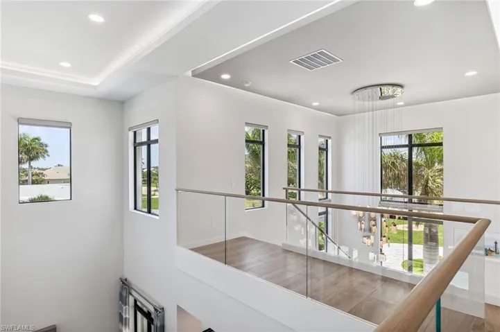 second floor Hall with recessed lighting, wood finished floors, and an upstairs landing