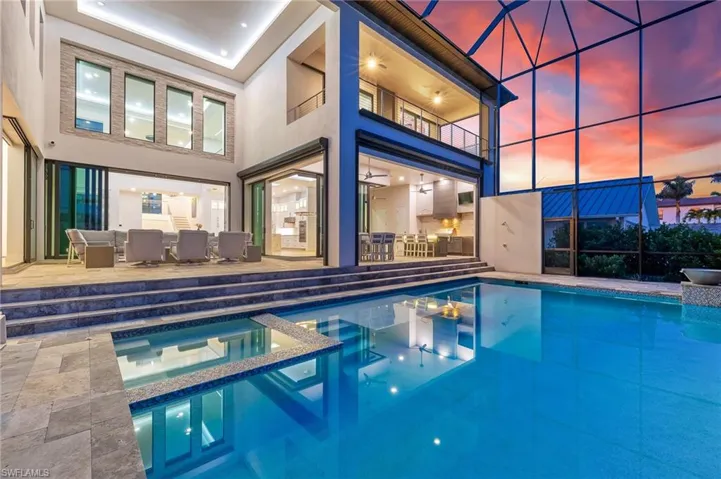 View of swimming pool with a pool with connected hot tub