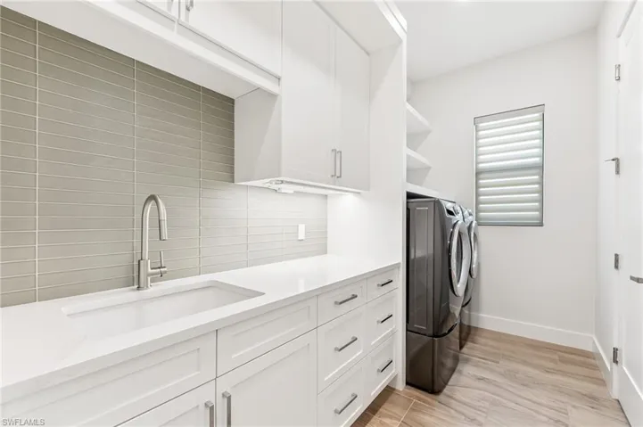Bathroom with tile walls and wainscoting