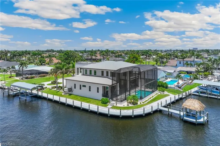 View of patio featuring outdoor lounge area, an outdoor pool, and a water view