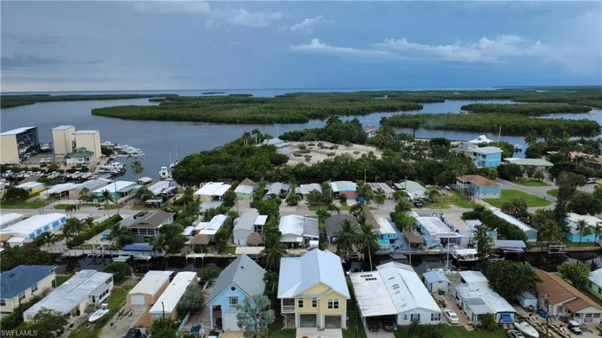 Aerial view of residential area featuring a large body of water