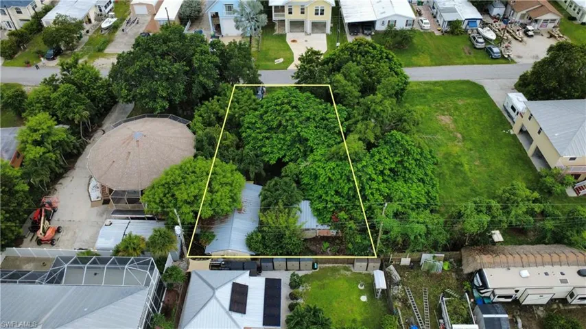 Aerial perspective of suburban area with property parcel outlined