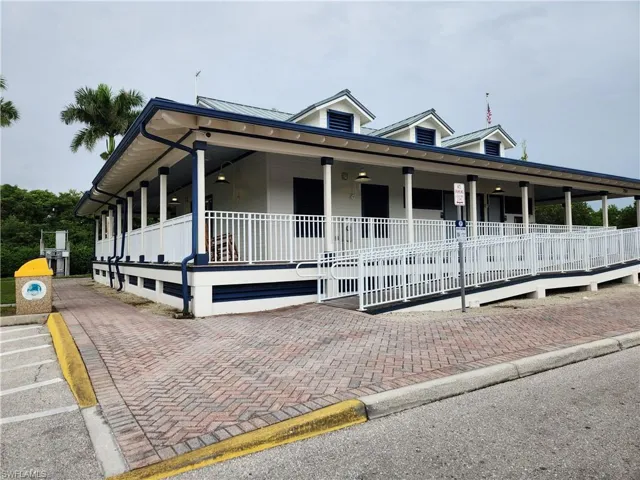 View of front of house with covered porch and a metal roof