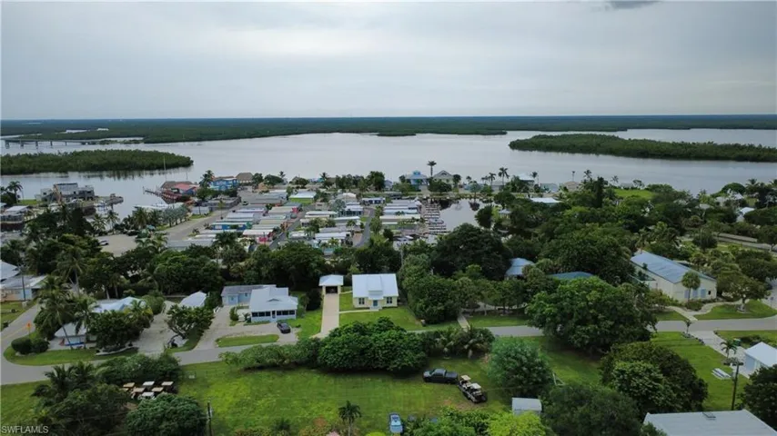 Aerial overview of property's location featuring nearby suburban area and a nearby body of water