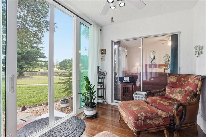 UPDATED FLOOR-TO-CEILING CUSTOM IMPACT SLIDERS WITH SCREENING ADDING ADDITIONAL OUTDOOR 1ST FLOOR LIVING SPACE WHILE ENJOYING THE SERENE WATER VIEWS AND BIRD WATCHING!!!