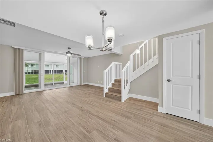 Completely updated first floor with new Impact Resistant doors and windows, window coverings, A/C, LV flooring, trim, paint, electric panel, light fixtures and fans, doors, kitchen appliances, cabinets, quartz countertops, water heater and bathroom fixtures.