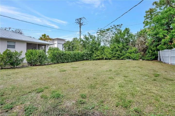 View of fenced backyard