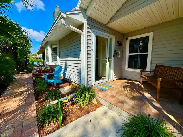 Property entrance with a patio area