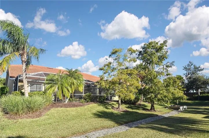 View of yard with a lanai