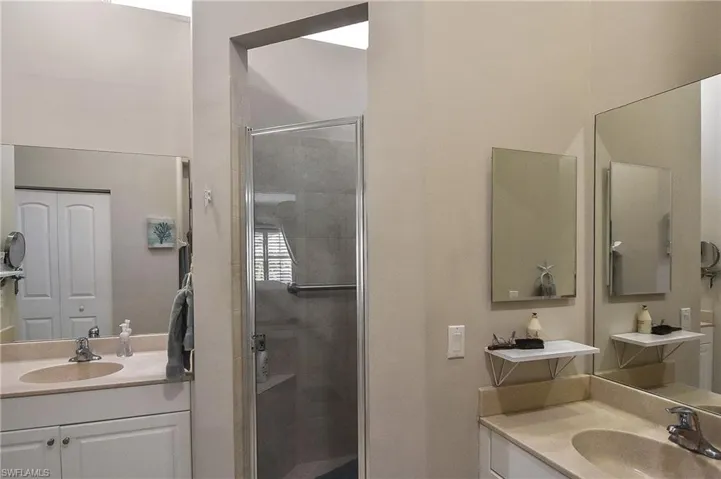 Bathroom with vanity and walk in shower