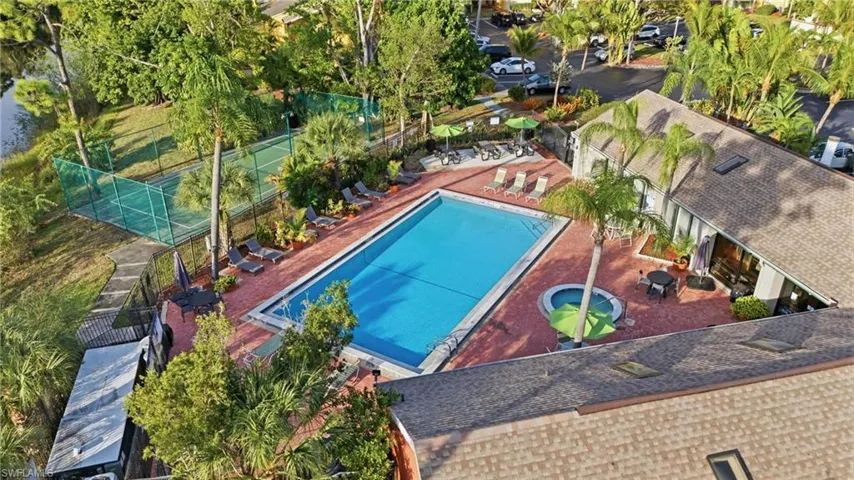 Community pool with a patio