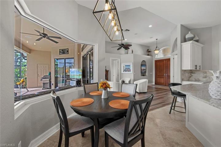 Dining area overlooking the pool and lanai