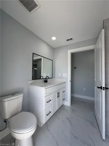 Bathroom with vanity and toilet