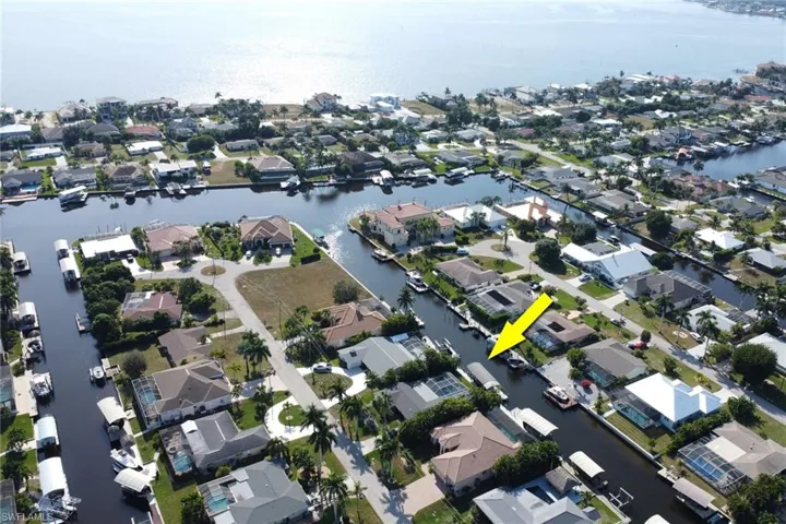 Aerial view of property's location featuring nearby suburban area