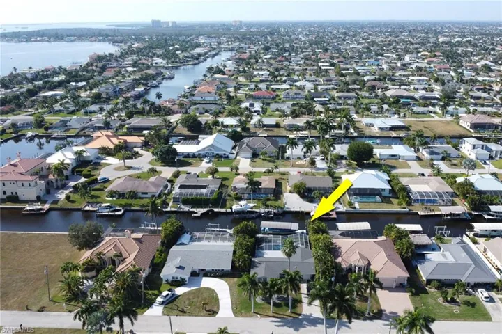View of property location with nearby suburban area and a nearby body of water