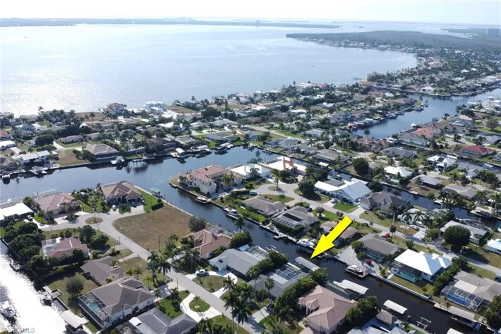 Aerial overview of property's location featuring nearby suburban area