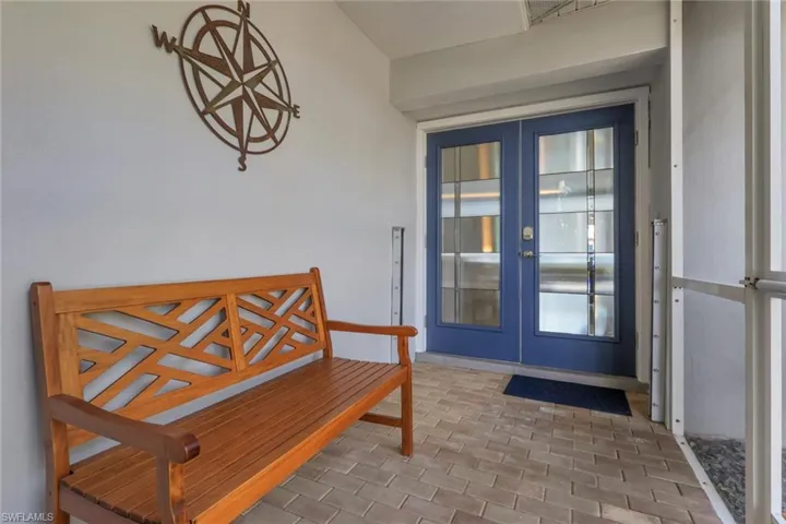 Entrance to property with french doors, a patio area, and stucco siding