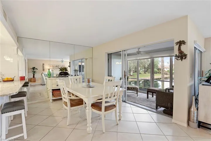 Dining area opens to slider enclosed porch