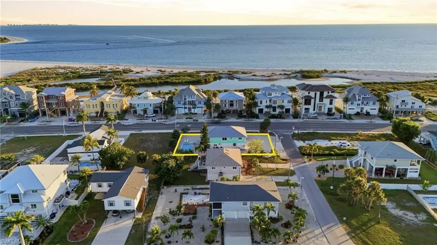 Aerial view of residential area with a large body of water - Virtually Edited Image