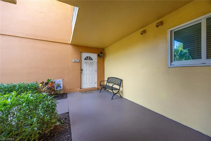 Entrance to property featuring stucco siding