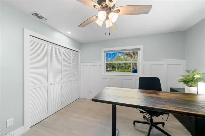 3rd bedroom / Office with light hardwood / wood-style flooring and ceiling fan