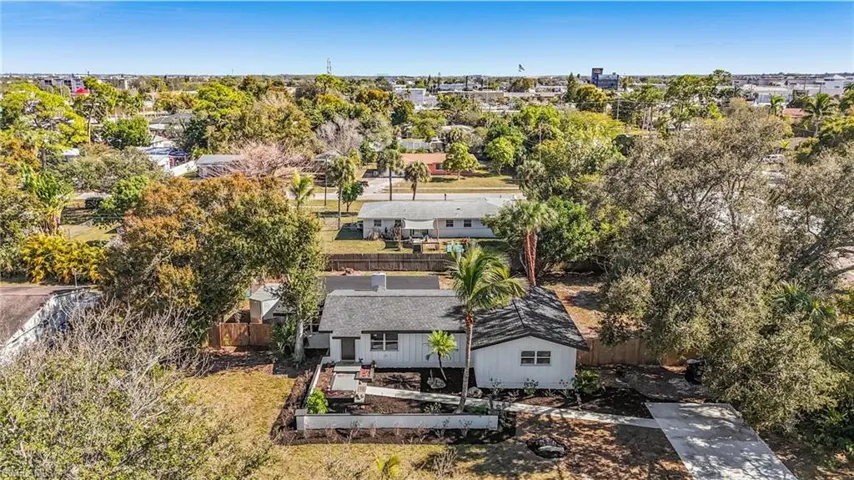 Aerial perspective of suburban area with a tree filled landscape