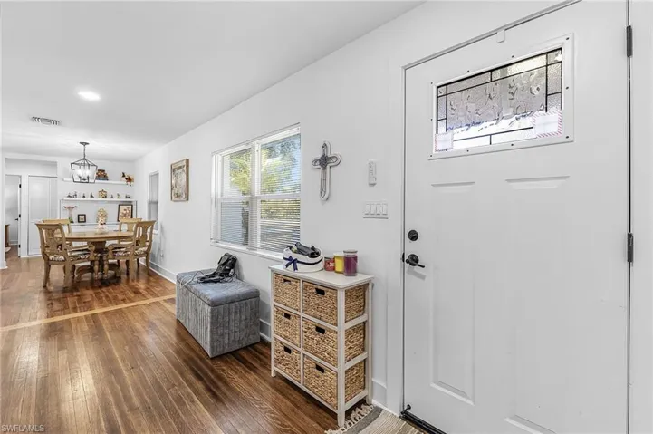 Foyer entrance featuring dark wood-style floors