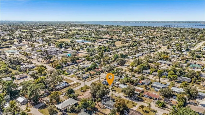 Aerial overview of property's location with nearby suburban area, a notable bridge, and a nearby body of water