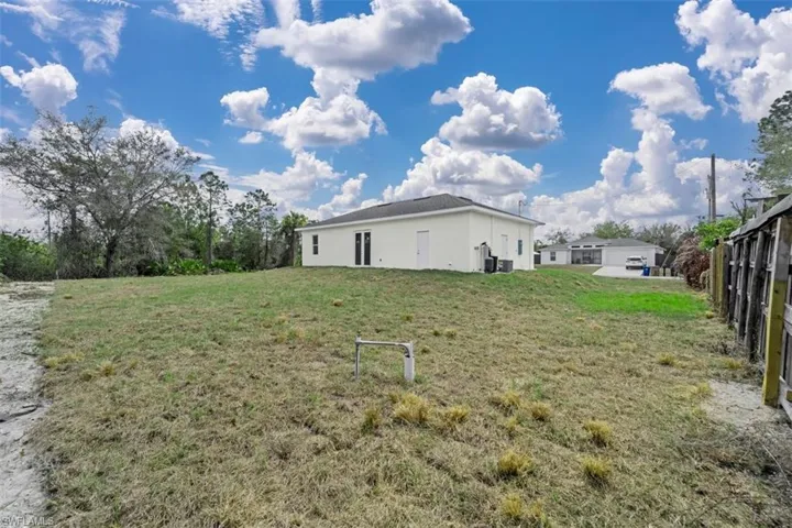 View of property exterior featuring stucco siding and a central air condition unit
