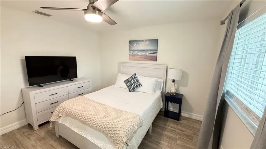 Bedroom featuring a ceiling fan and light wood finished floors