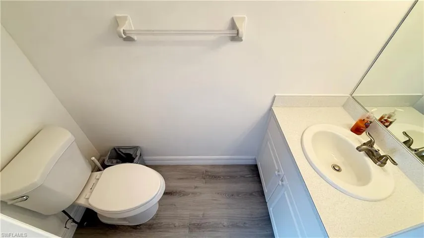 Half bath featuring vanity and toilet