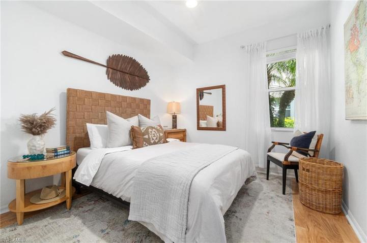Custom flooring adorns the guest bedroom, which has also been decorated in the boho chic, comfortable theme.