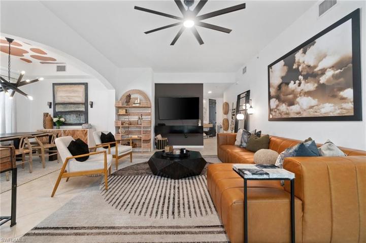 The living space opens up into the dining area where a decorative ceiling, and new designer light fixture enhance the space adding a special ambiance.
