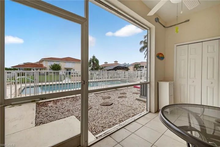 Sunroom / solarium featuring a residential view