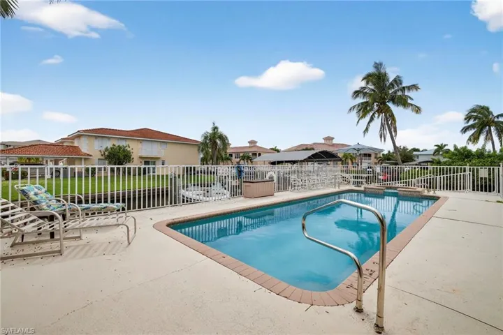 View of pool featuring a patio area and a residential view
