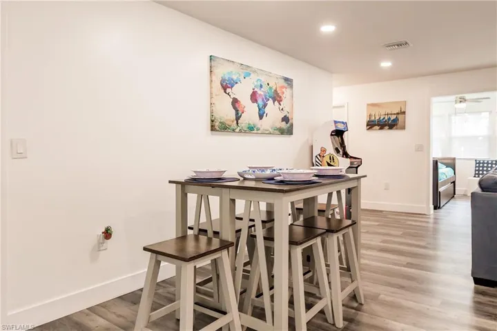 Dining space featuring light wood-type flooring, recessed lighting, and ceiling fan