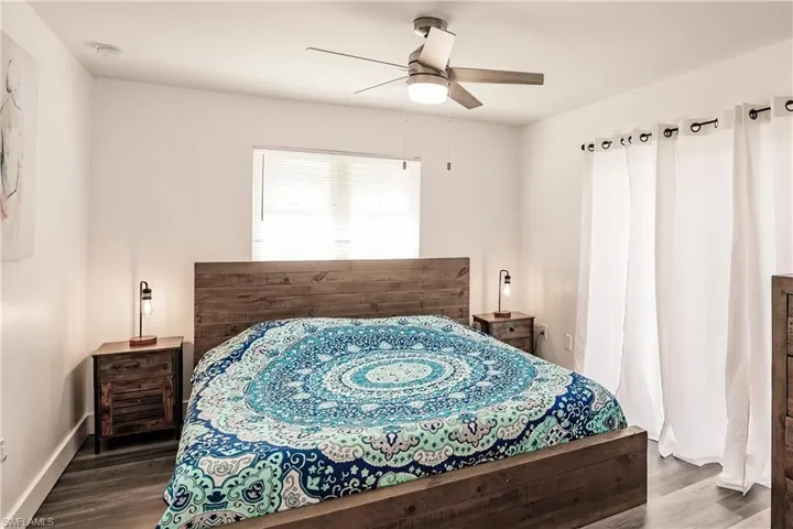 Bedroom featuring wood finished floors and ceiling fan