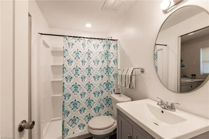 Bathroom featuring vanity and recessed lighting