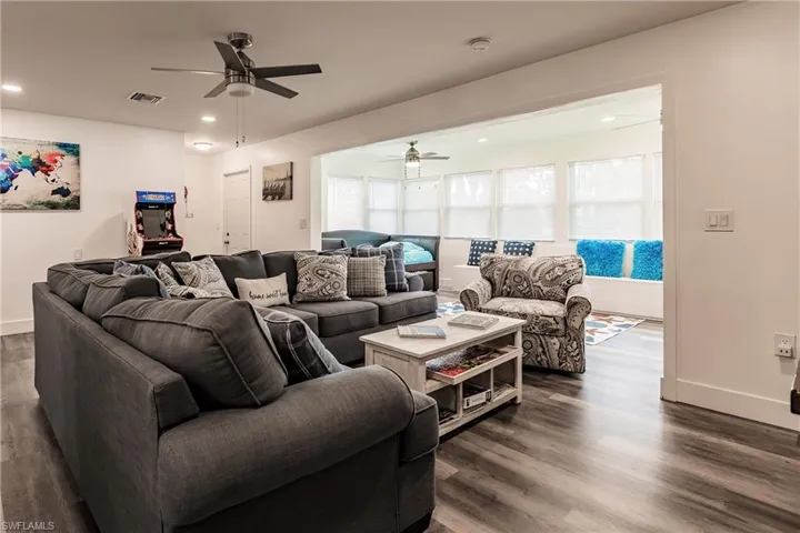 Living room featuring recessed lighting, wood finished floors, and a ceiling fan