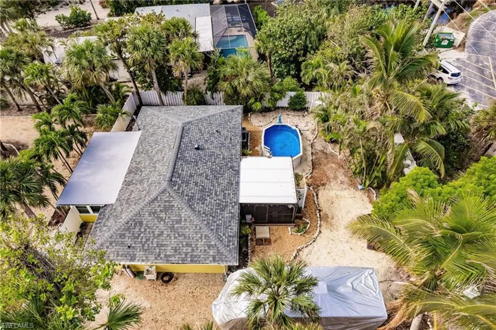 View of subject property with a pool