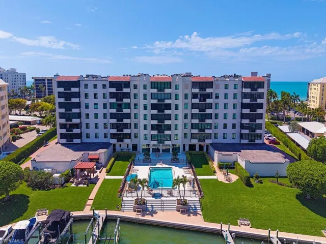 Drone / aerial view of a large body of water and a pool