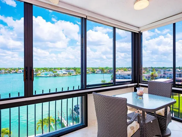 Sunroom / solarium with a water view