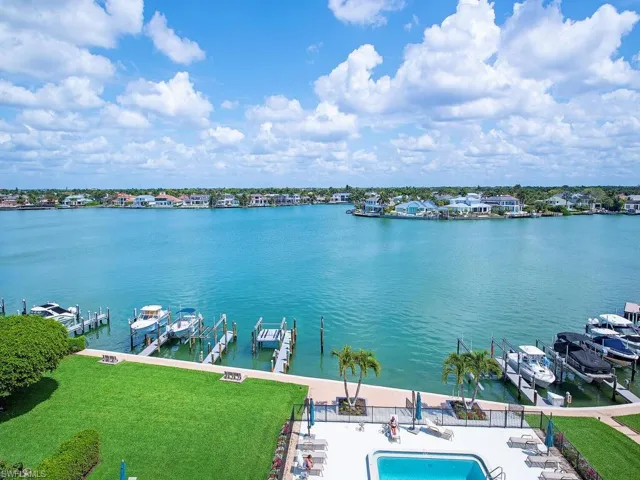Water view with boat lift and a dock