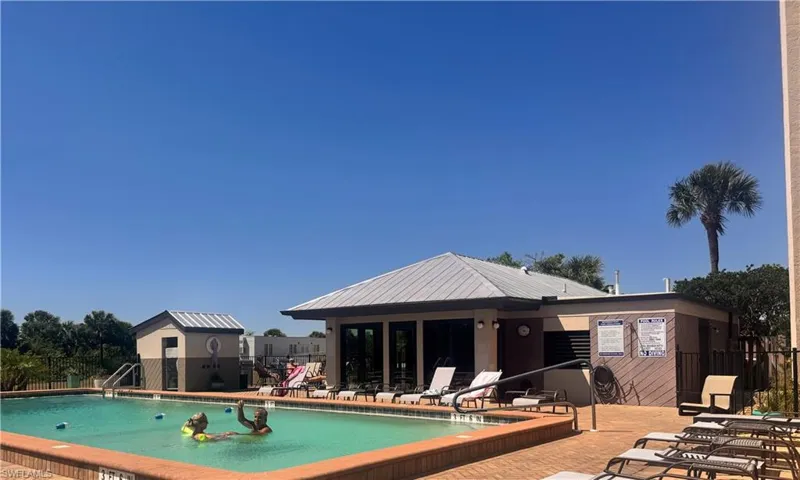 Community pool featuring a patio