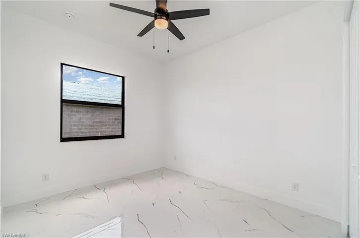 Guest bedroom #1 with ceiling fan