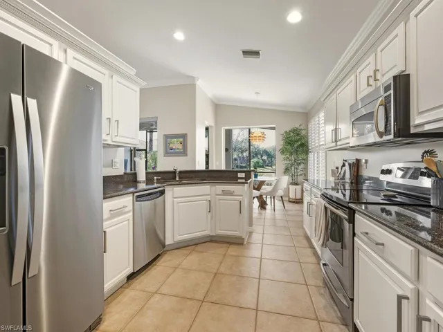 Spacious kitchen with plenty of cabinets.