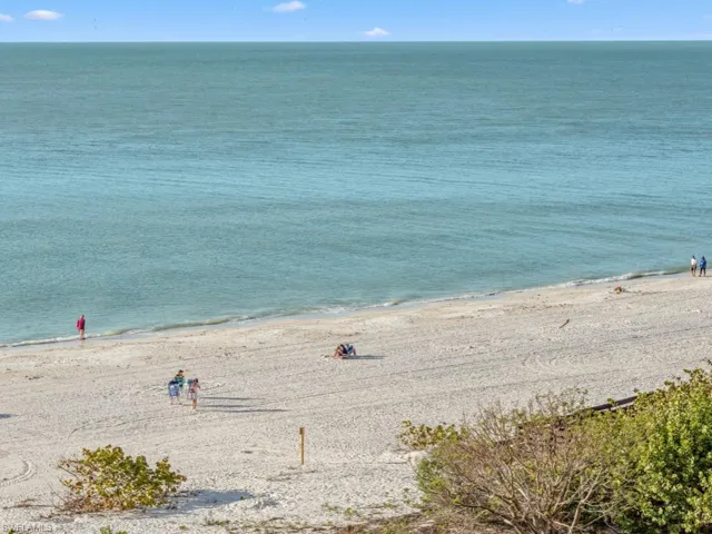 Property view of water with a beach view
