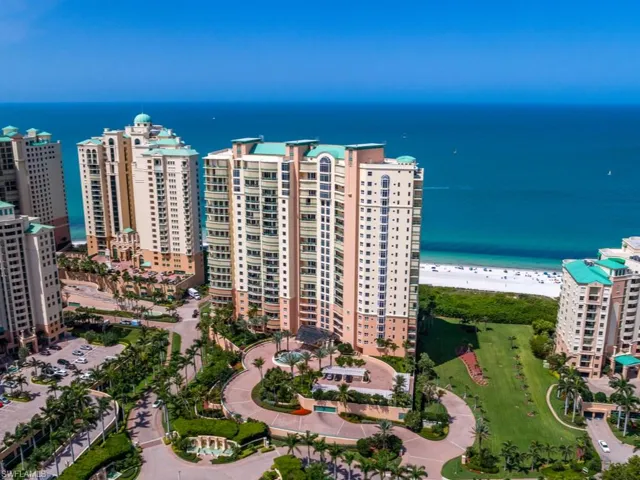 Drone / aerial view with a water view and a view of the beach
