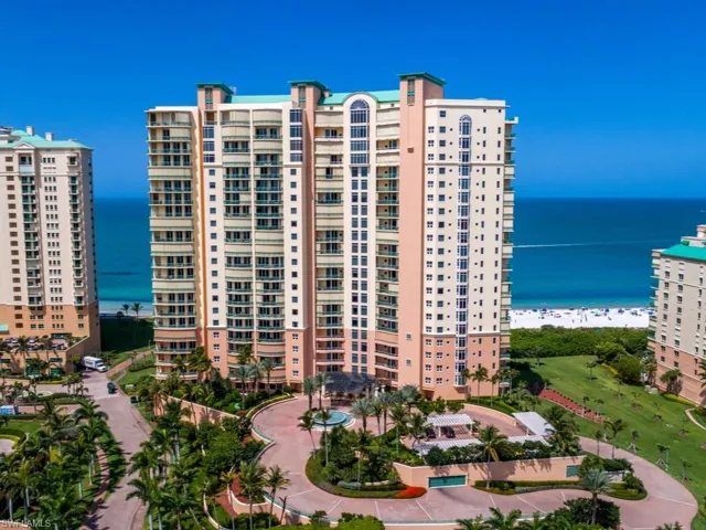 View of property featuring a view of the beach and a water view