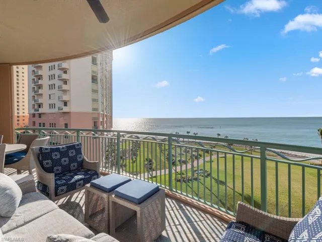 Balcony with ceiling fan and a water view